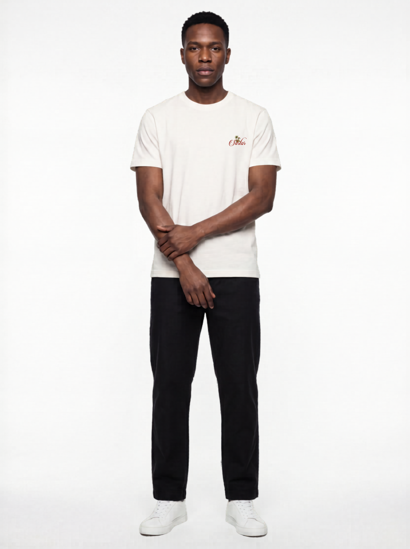 Male fashion model wearing a black SARTOR streetwear T-shirt